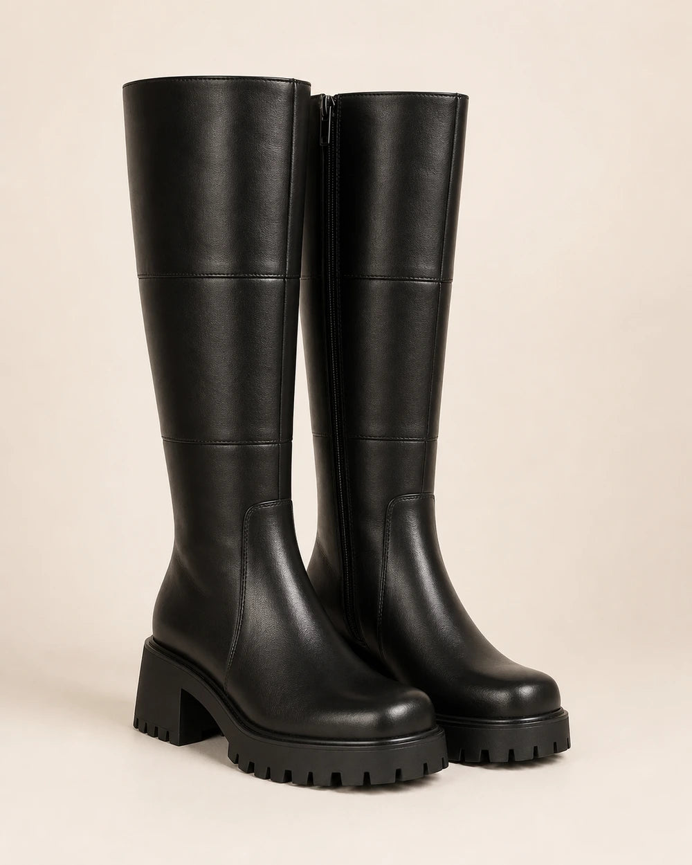 Women's black chunky knee-high boots, product-only pair.
