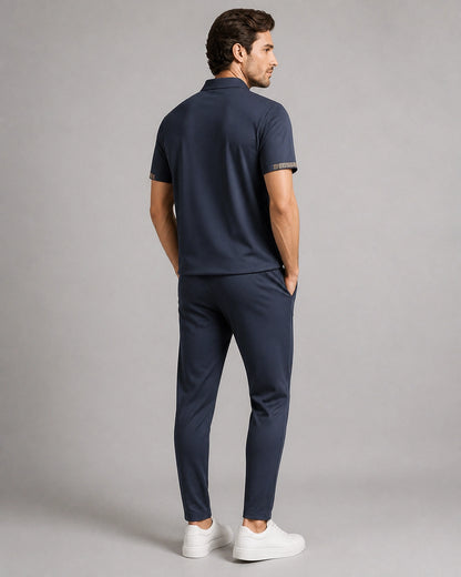 Blue men's polo and trousers set, rear view.