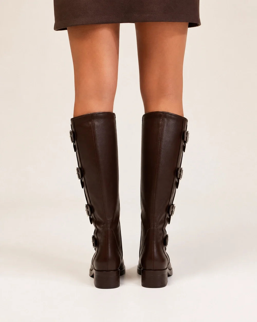 Brown knee-high multi-buckle biker boots rear view