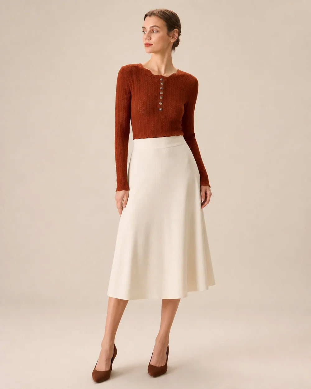 Women's rust fitted button-detail knit top styled with cream midi skirt