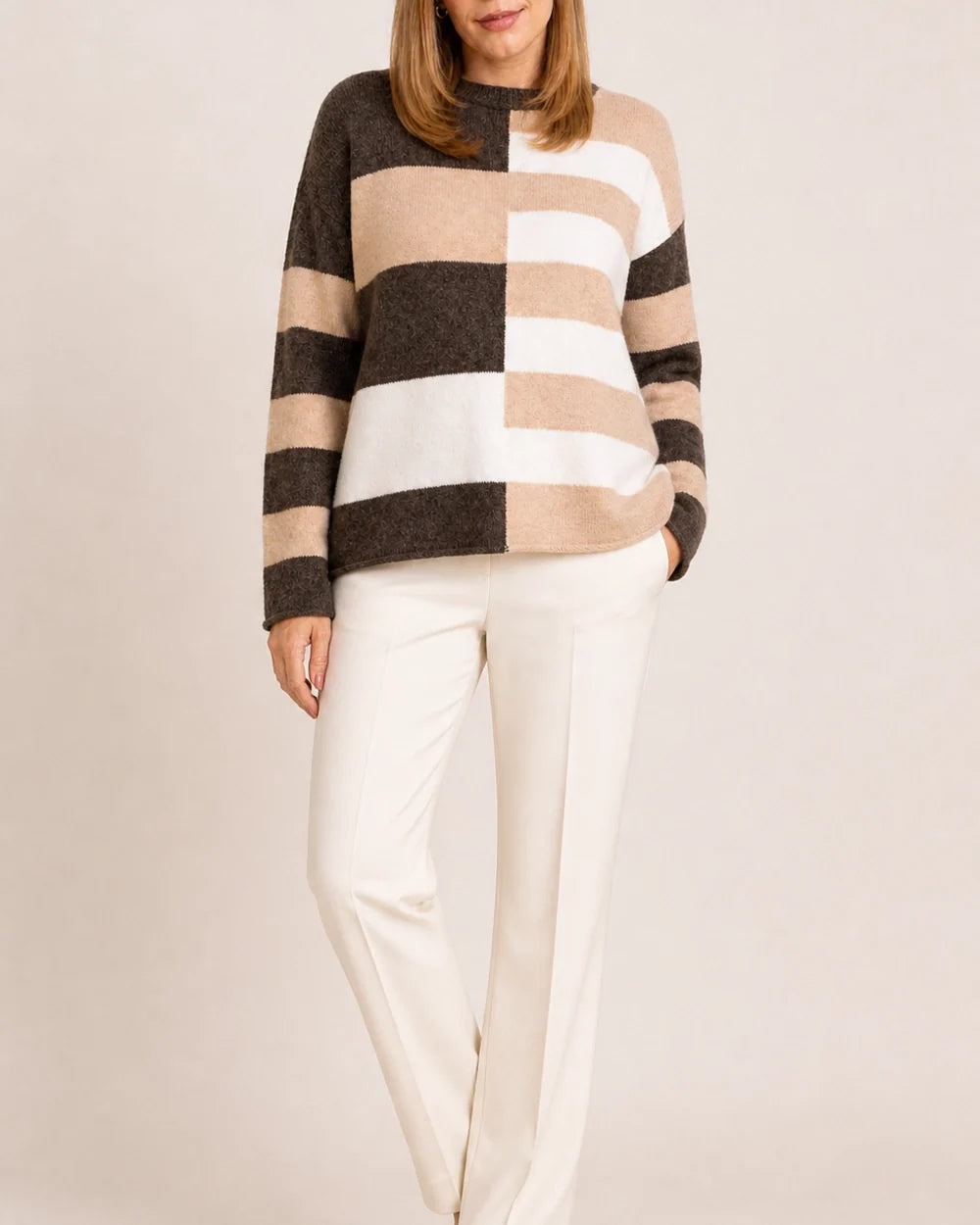 Women's taupe colour-block stripe sweater styled with cream trousers