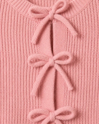 Close-up of the pink rib knit and tonal bow ties.