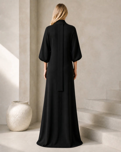 Women’s black maxi dress, rear view with long neck sash